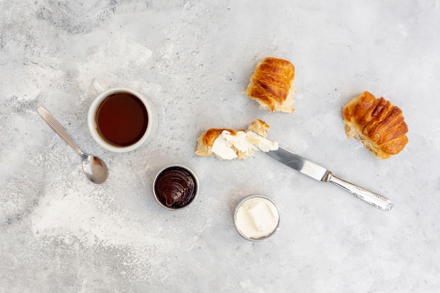 Top view arrangement with tasty breakfast and stucco background