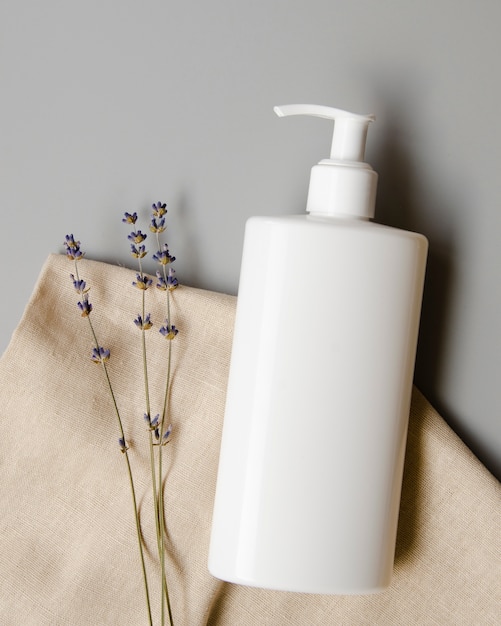 Free photo top view arrangement with white soap bottle