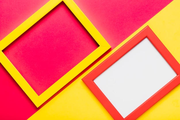 Free Photo top view arrangement with yellow and red frame 