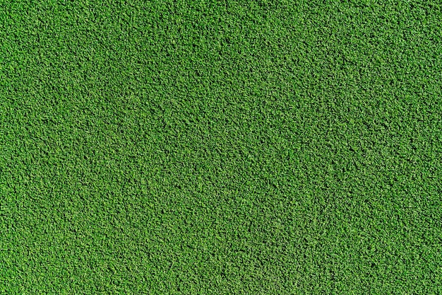 Free photo top view artificial grass soccer field  background texture