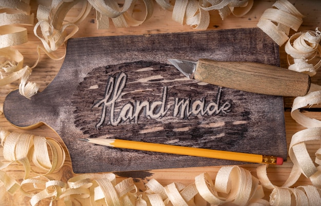 Free Photo top view artisan jobs equipment and hand made words on wood