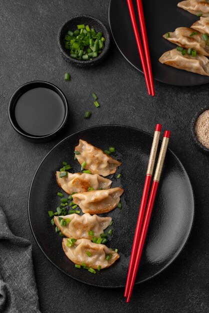 Top view of asian dish on plate with chopsticks