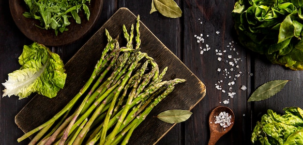 Free photo top view of asparagus with salad