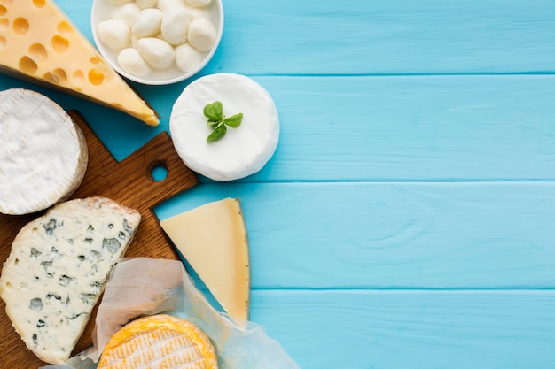 Top view assortment of cheese with copy space