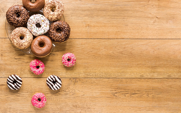 Top view of assortment of donuts with copy space