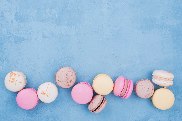 Top view of assortment of macarons with copy space