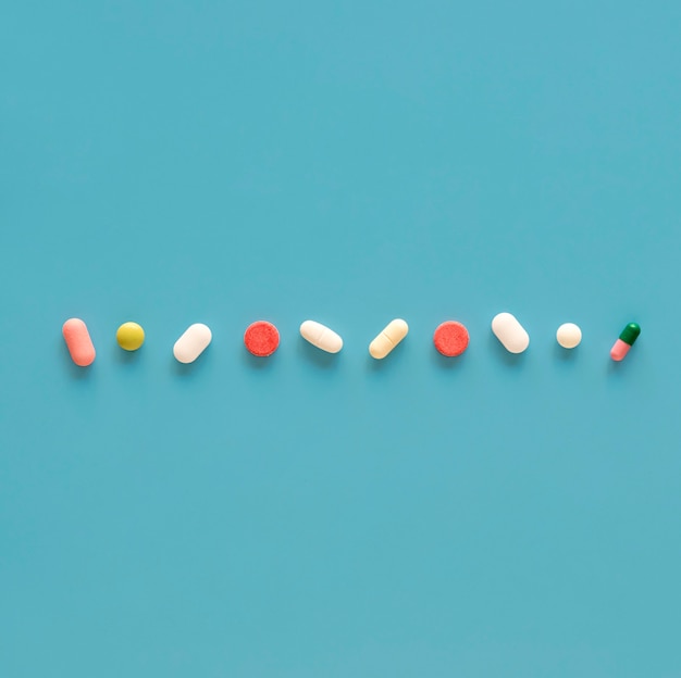 Top view of assortment of pills in line