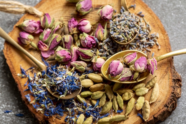 Free photo top view of assortment of spices on wooden board