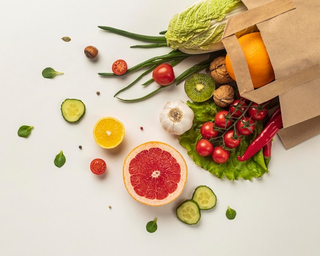 Free photo top view of assortment of vegetables in grocery bag