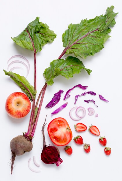 Top view assortment of vegetables with strawberries