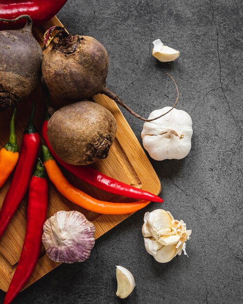 Top view assortment of veggies on cutting board