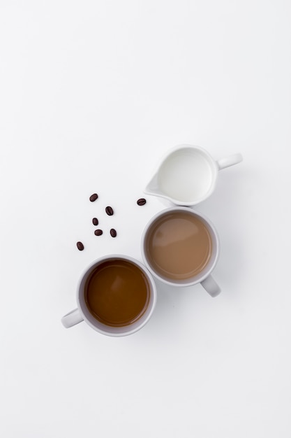 Top view assortment with coffee cups and milk