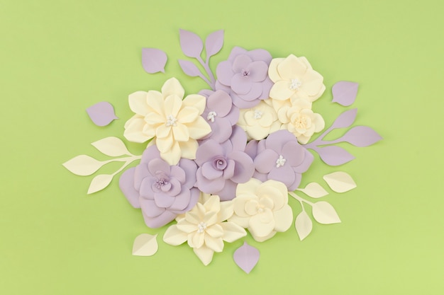 Free photo top view assortment with flowers and green background