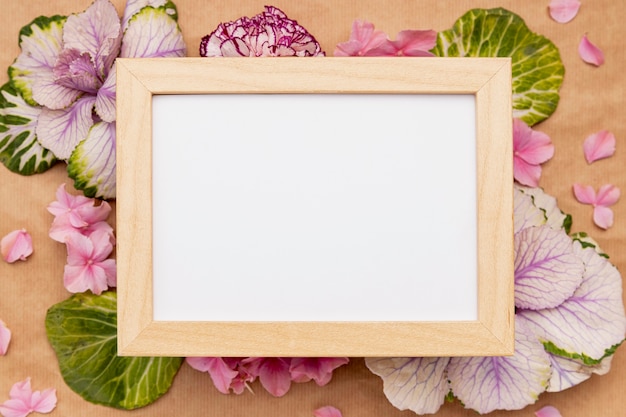 Free photo top view assortment with frame and flowers