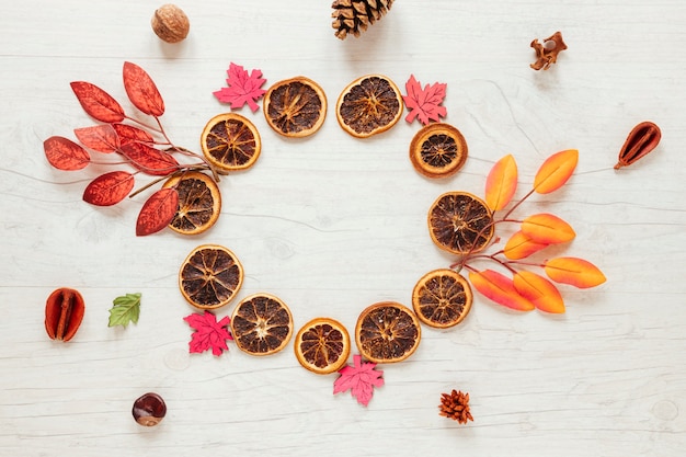 Free Photo top view autumn arrangement on wooden background