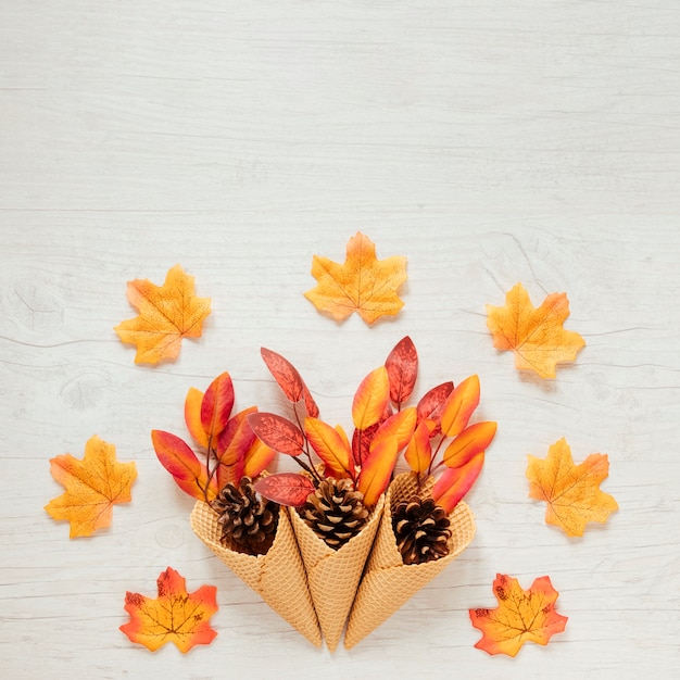 Free Photo top view autumn leaves in ice cream cone