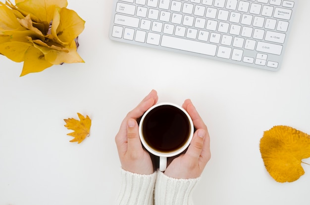 Free Photo top view autumn leaves with coffee