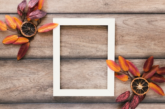 Top view autumn leaves with white frame