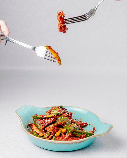 Top view of avocado salad with meat and sesame