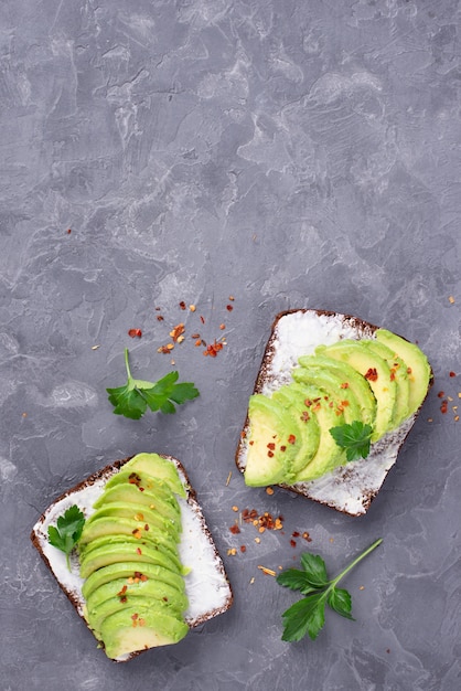 Free Photo top view of avocado toast with herbs and copy space