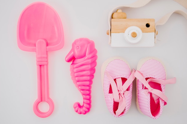 Top view baby shoes with pink toys