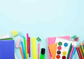 Free photo top view of back to school stationery with copy space and watercolor