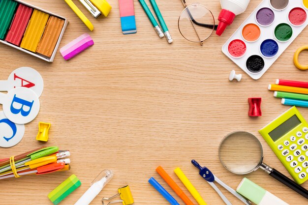 Top view of back to school supplies with pencils and copy space