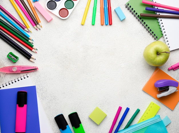 Top view of back to school supplies with pencils and copy space