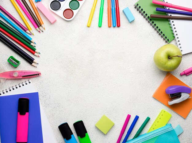 Top view of back to school supplies with pencils and copy space