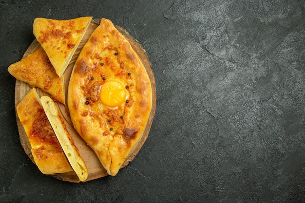 Top view baked egg bread delicious fresh off the oven on dark grey space