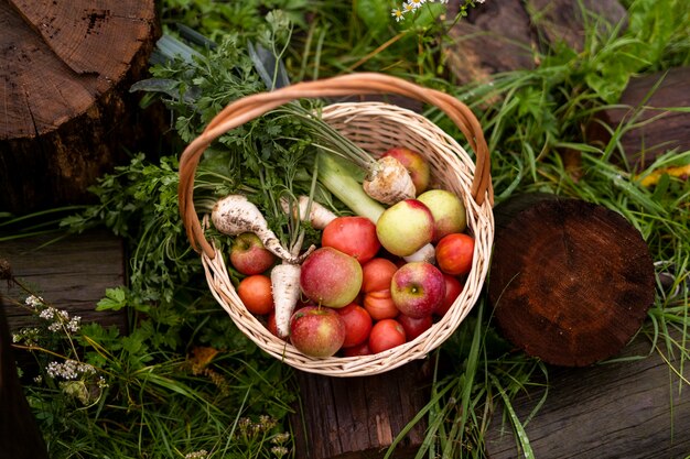 Top view basket with apples and vegetables