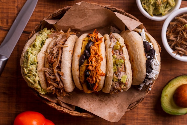 Top view of basket with assortment of arepas