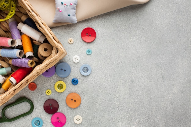 Top view basket with threads for sewing and buttons