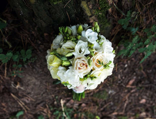 Free Photo top view of beautiful wedding bouquet on the ground