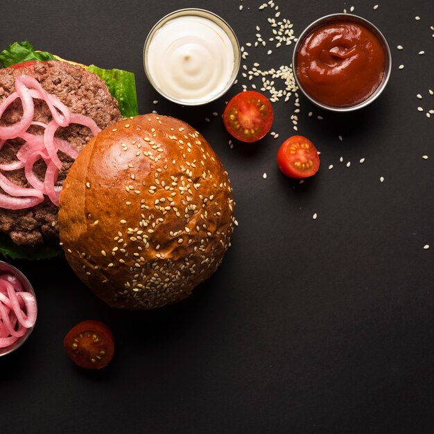 Free Photo top view beef burger with tasty sauces