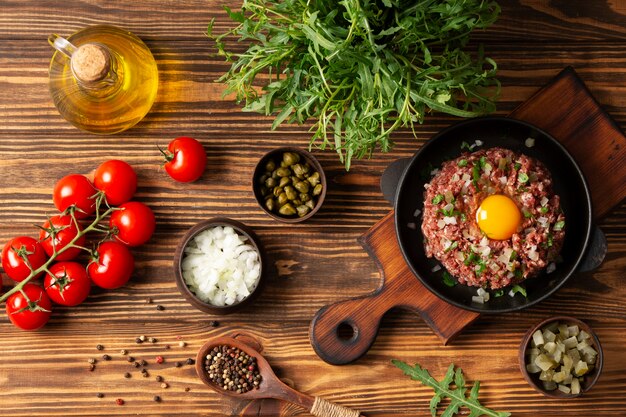 Top view beef steak tartar still life