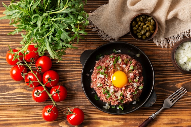 Top view beef steak tartar still life