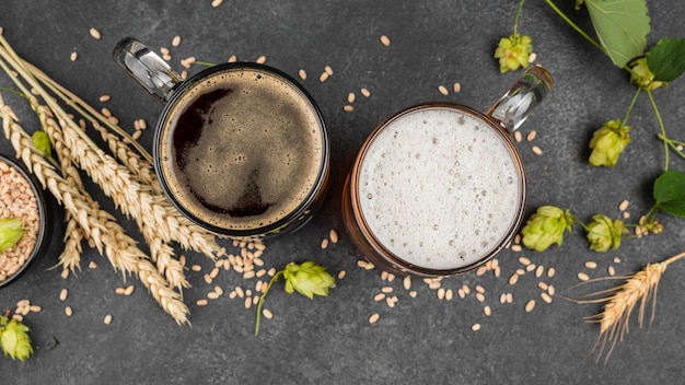 Top view beer mugs and wheat seeds