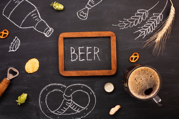 Free photo top view beer with chalkboard background