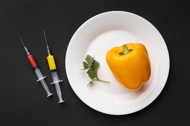 Top view bell pepper and syringes