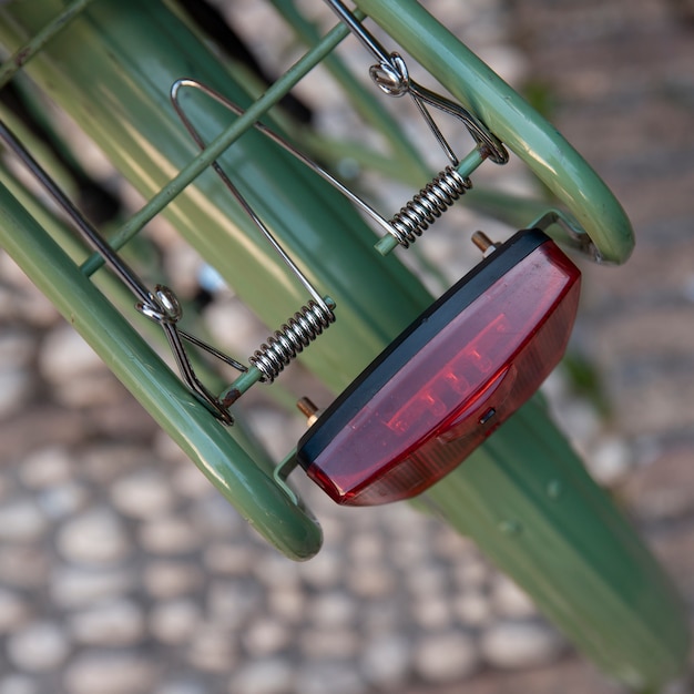 Free photo top view of bicycle with light and defocused pavement