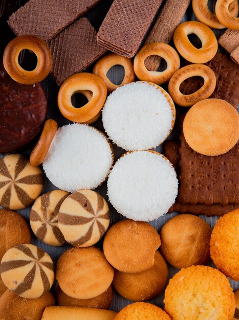 Top view biscuit mix with marshmallows dry bagels and chocolate waffles