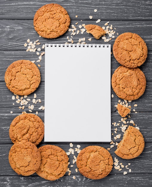 Free Photo top view biscuits and empty notepad