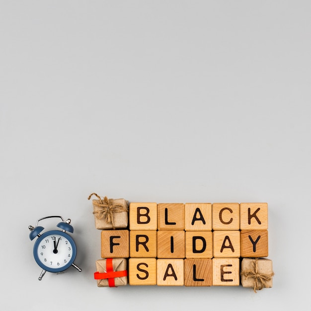 Free photo top view of black friday cubes on plain background