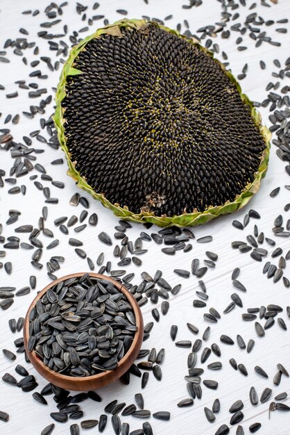 A top view black sunflower seeds fresh and tasty inside shell grain sunflower snack oil