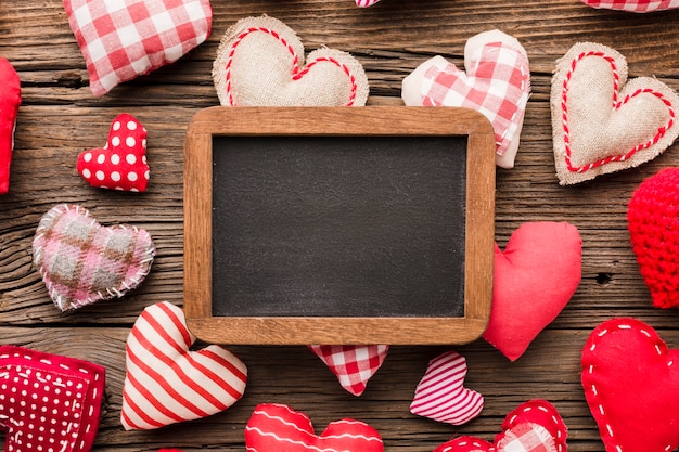 Top view of blackboard with valentines day ornaments