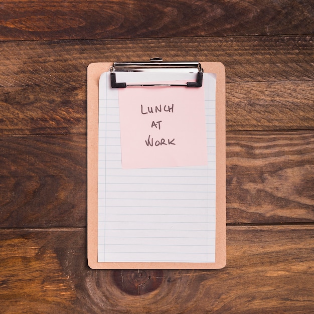 Top view blank clipboard with lunch at work post-it