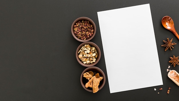 Top view of blank menu paper with star anise and copy space