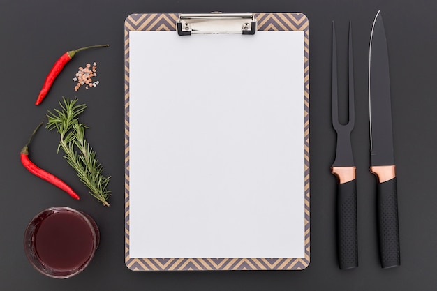 Free photo top view of blank menu with chili pepper and cutlery