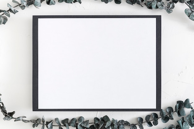 Free photo top view of blank menu with leaves